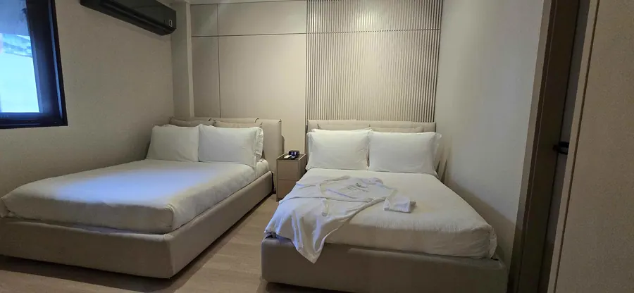 The City Suite bedroom with two double beds.