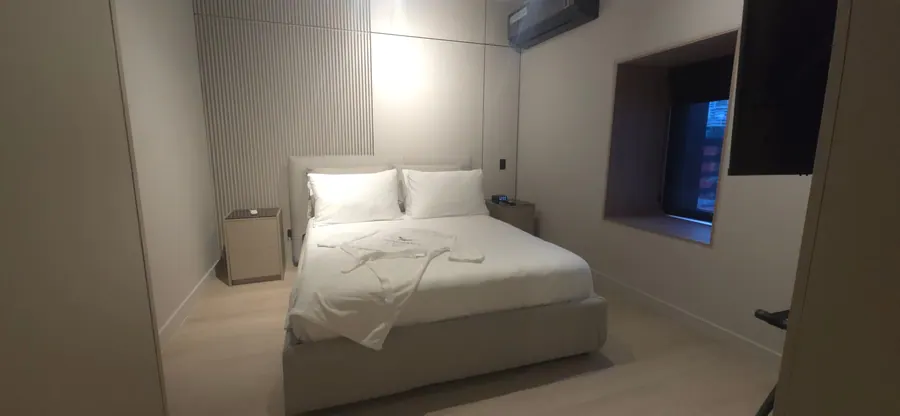 Studio Suite bedroom with king bed and window.