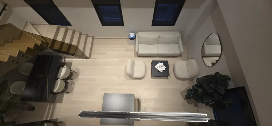 The Urban Loft living room and staircase from above.
